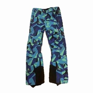 Spyder Orb softshell ski pants with a geometric blue and green pattern